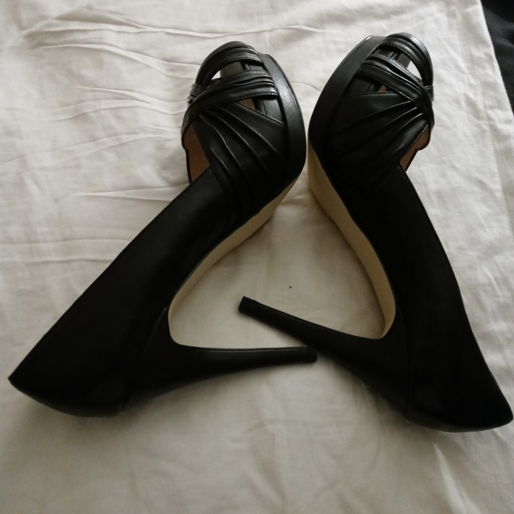 Black twist platform heels in size 10M. Worn once